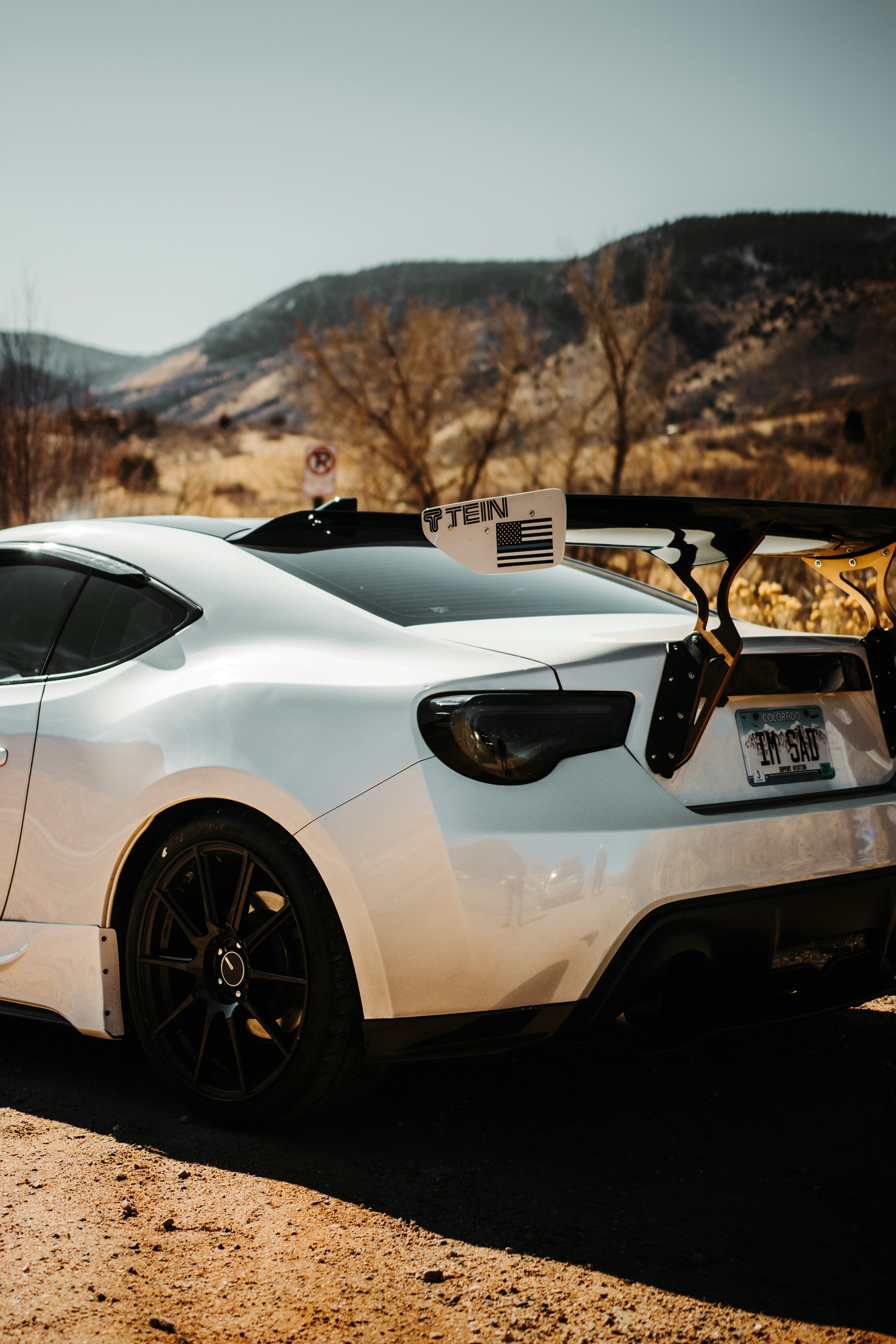 white lamborghini aventador on road during daytime